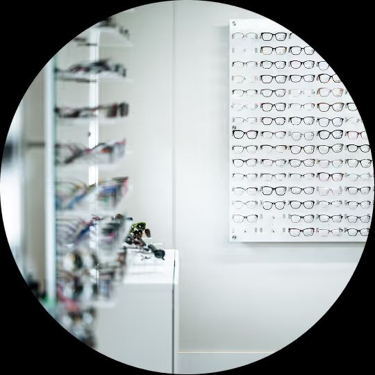 Display wall lined with pairs of eyeglasses